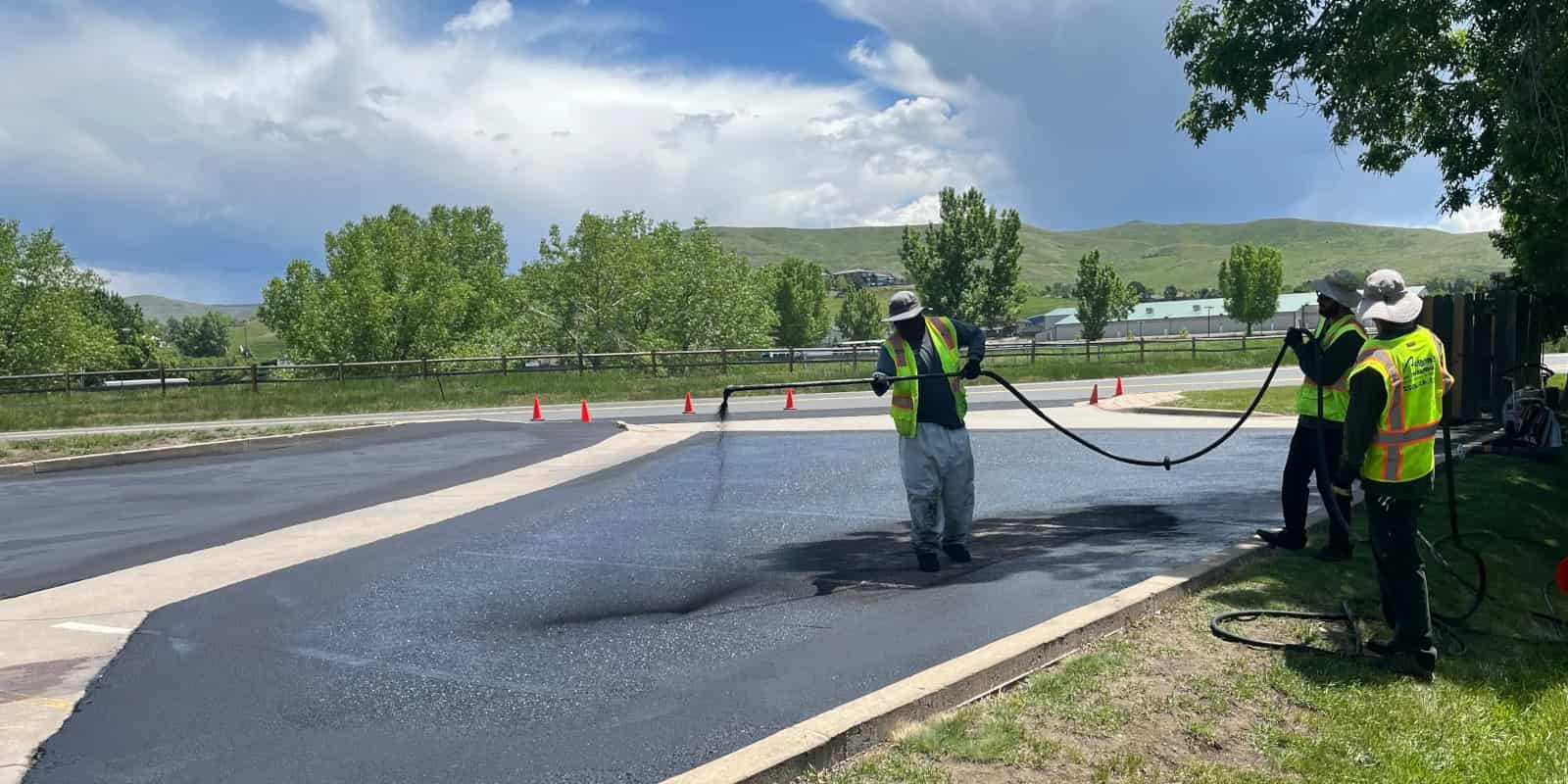 Crew sealcoating parking lot